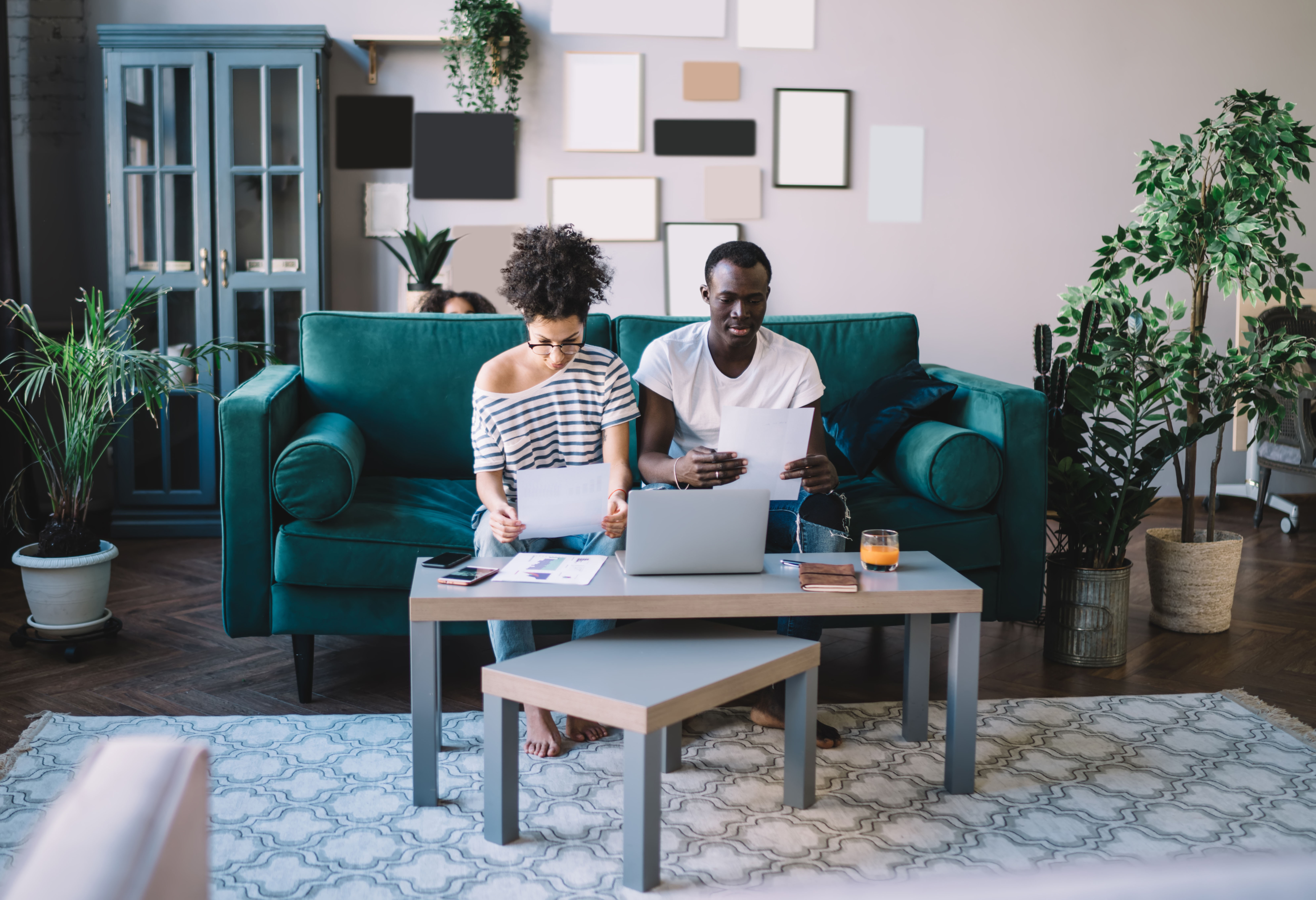 Couple looking at bills and computer