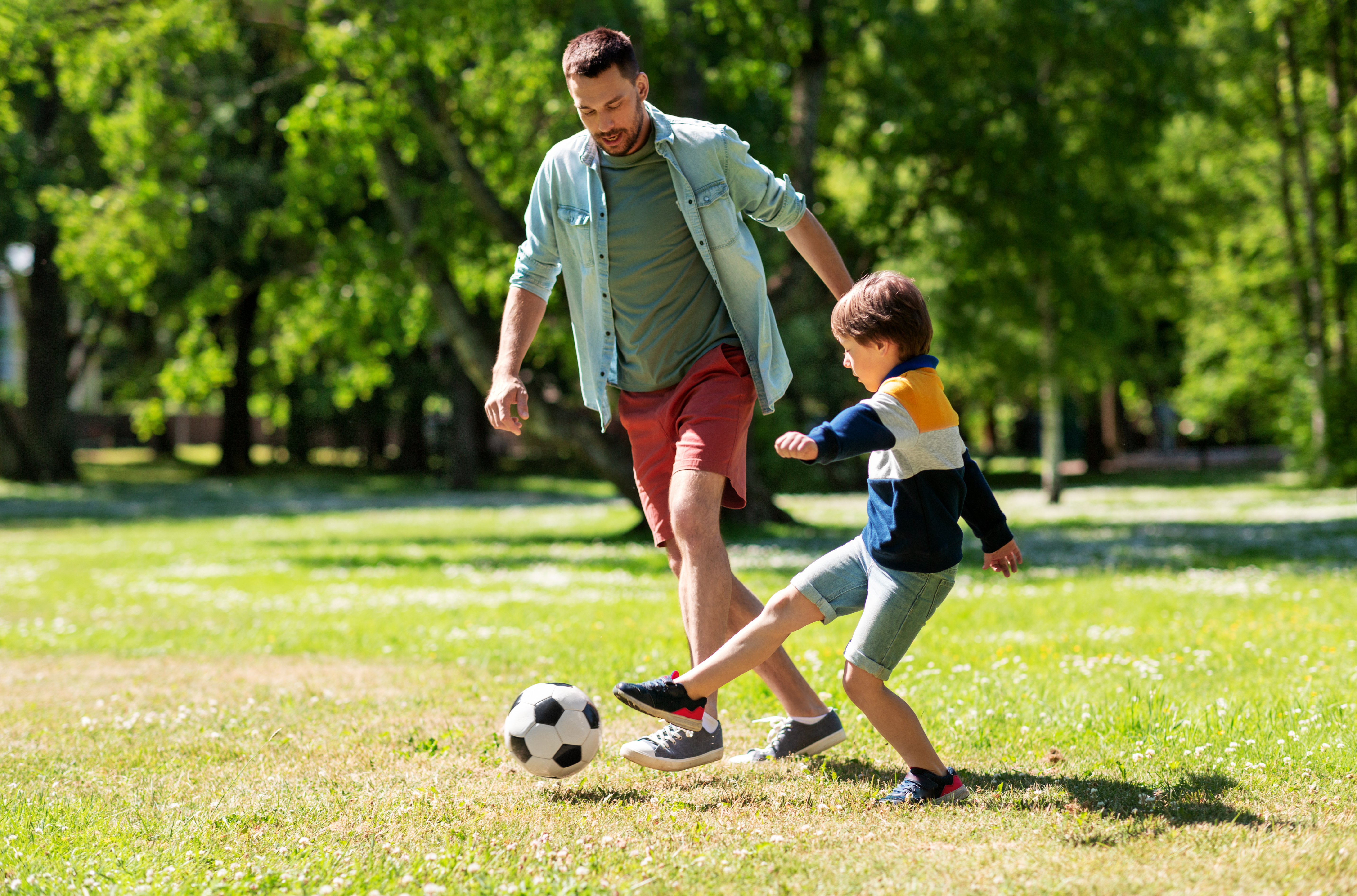 family playing soccer
