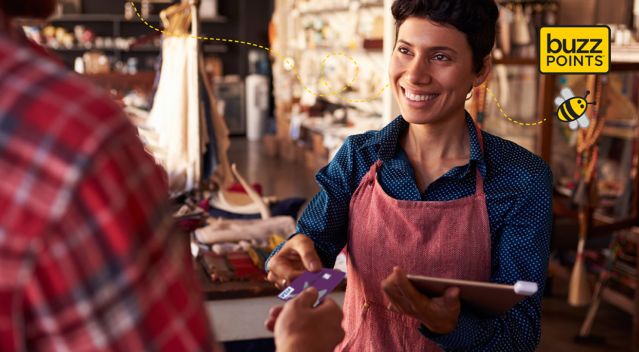 woman accepting umassfive debit card