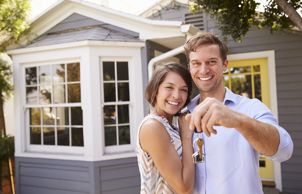 Couple with keys to a new home