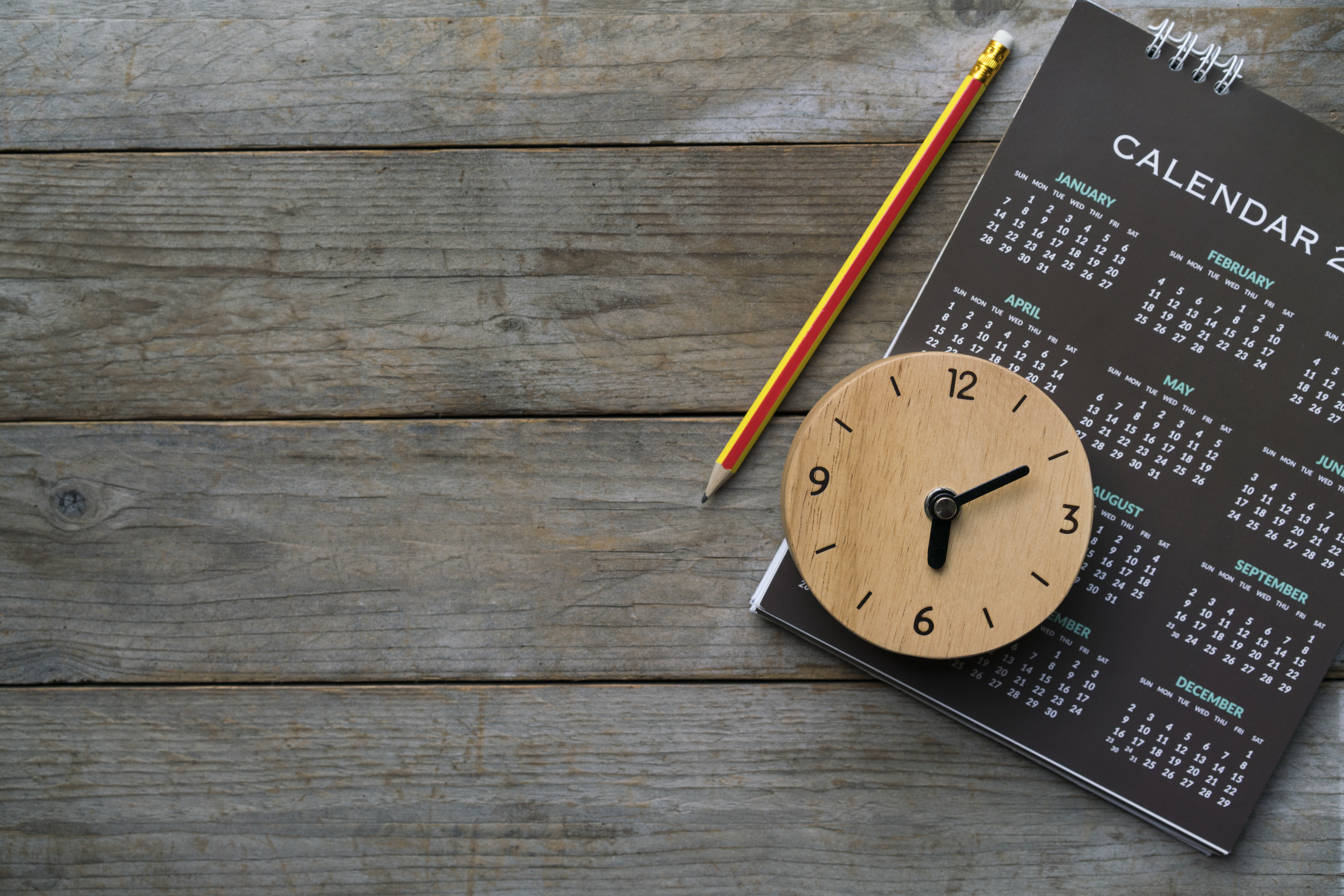 Image of a calendar and clock implying a term for savings
