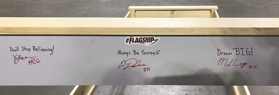 Headboard with messages written by the athletes
