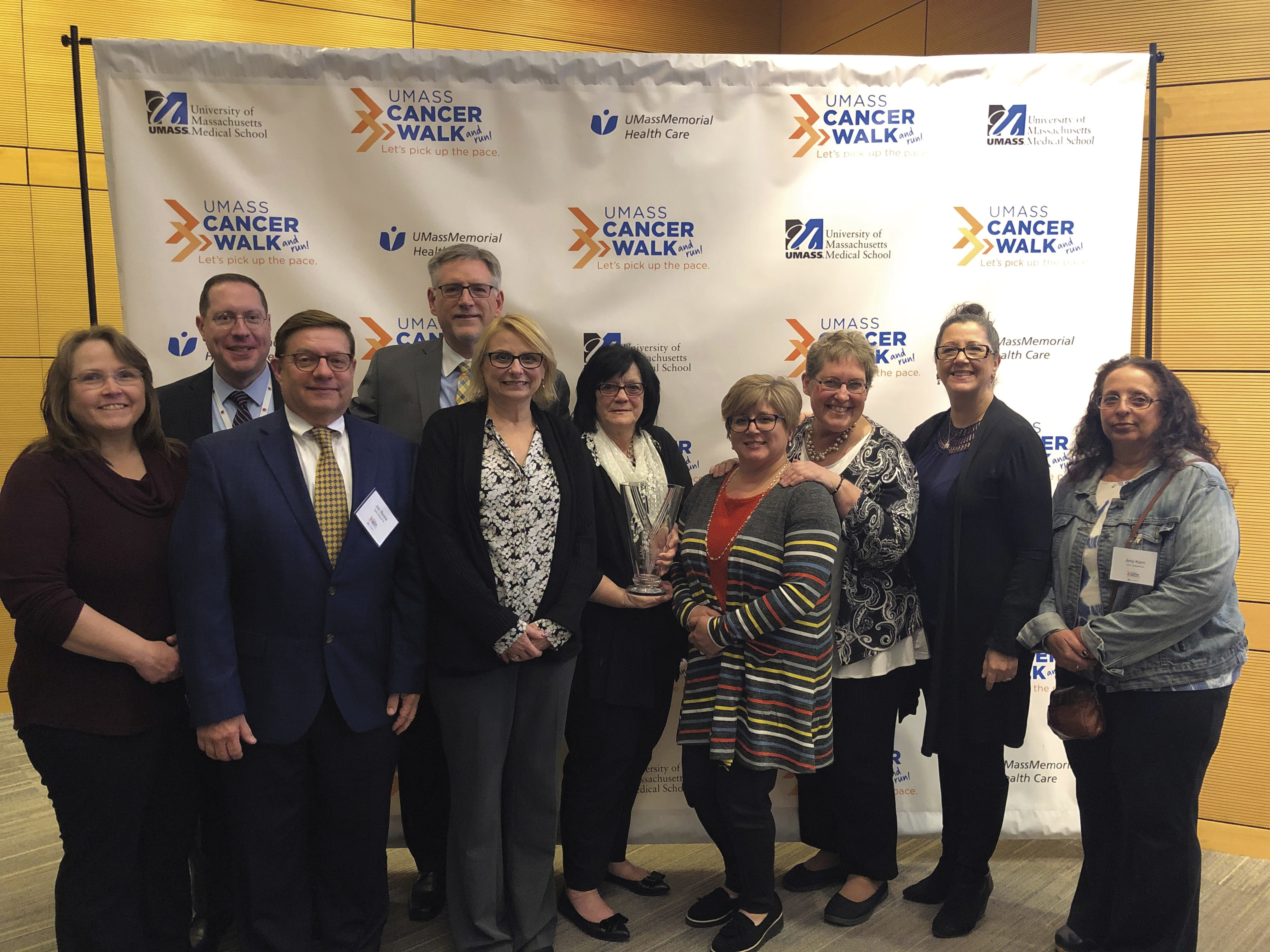 UMassFive representatives accepting the $100,000 lifetime giving award